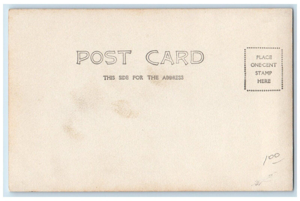c1905 Storefronts Barber Pole Shop Dogs Optician Dirt Road RPPC Photo Postcard