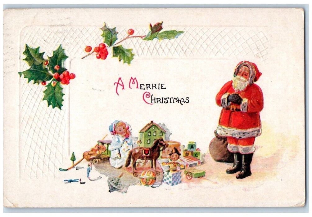 c1910's Christmas Santa Claus Preparing Toys Gift Holly Embossed Posted Postcard