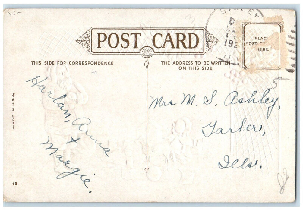 c1910's Christmas Santa Claus Preparing Toys Gift Holly Embossed Posted Postcard