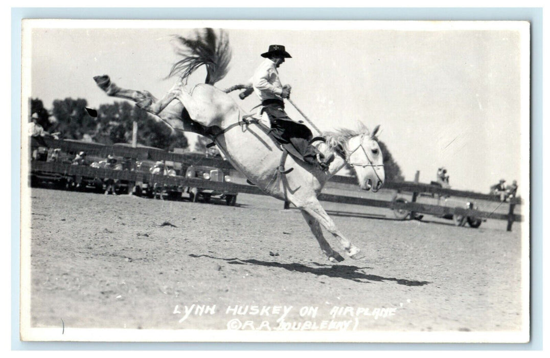 Lynn Huskey on Airplane R.R. Doublepay Rodeo RPPC Photo Postcard