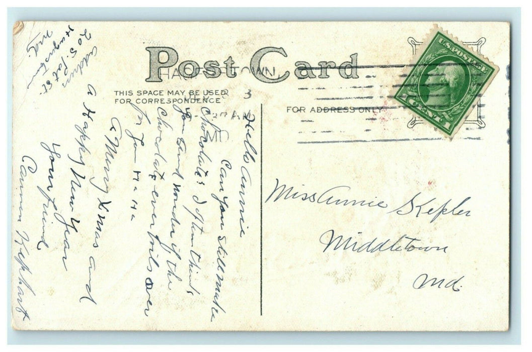 c1910 Christmas Girl Holding Kitten Cat Gold Embossed Hagerstown MD Postcard
