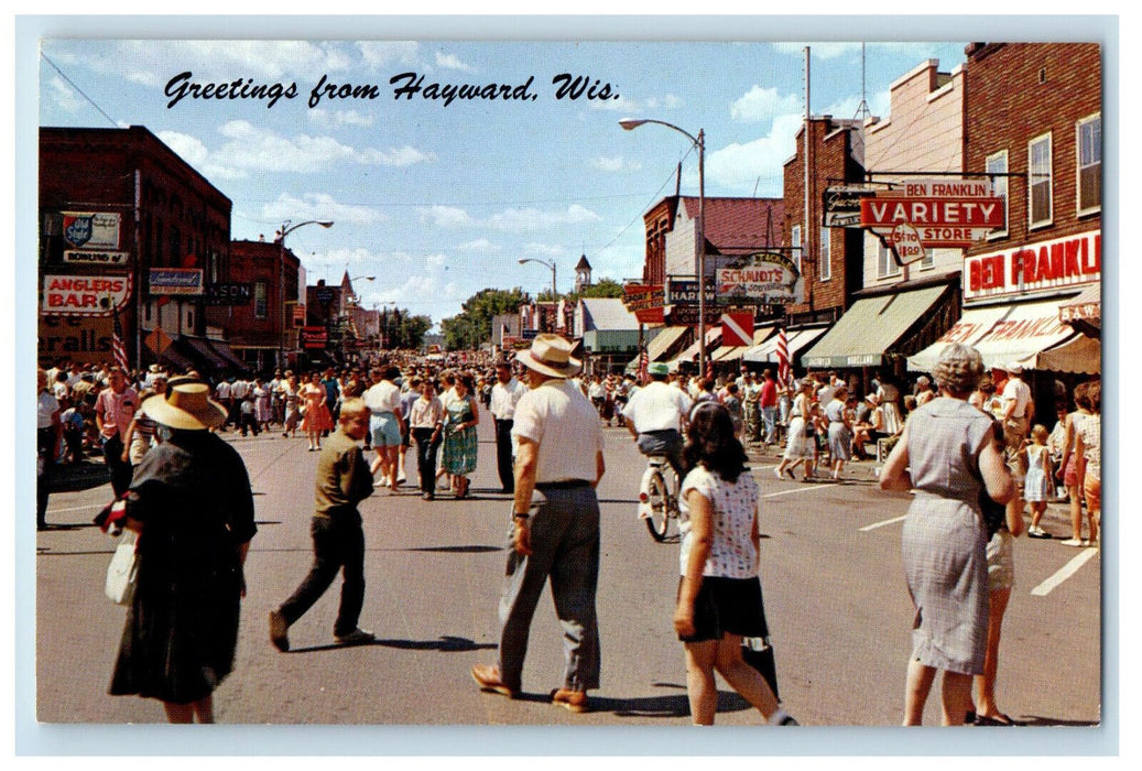c1950s Crowd Scene Greetings from Hayward Wisconsin WI Vintage Unposted Postcard