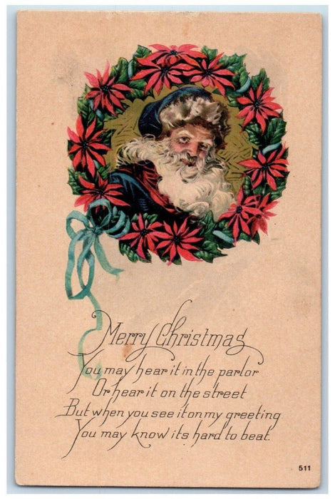 c1910's Christmas Wreath Pointessia Flowers Santa Head Unposted Antique Postcard