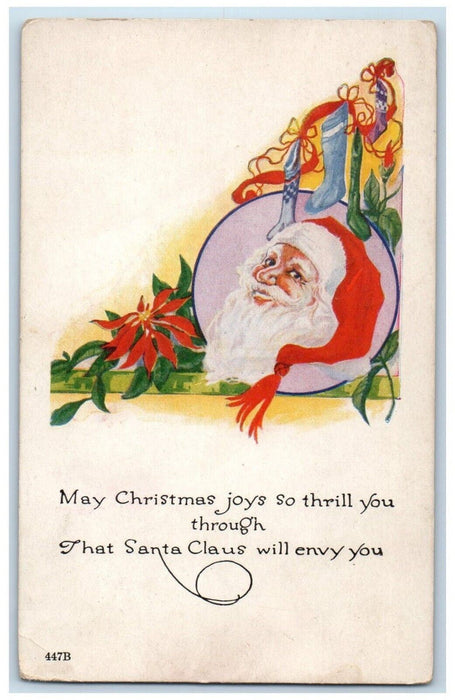 1922 Christmas Santa Claus Head Poinsettia Flowers And Stockings Posted Postcard