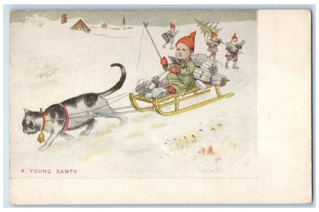 c1905 Christmas A Young Santi Cat Pulling Cart Sleigh Boy With Gifts Postcard
