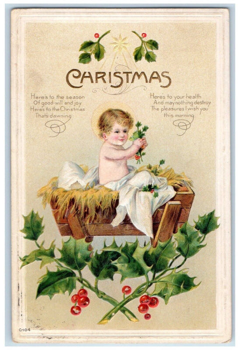 c1910's Christmas Baby In Basket Holly Berries Embossed Posted Antique Postcard