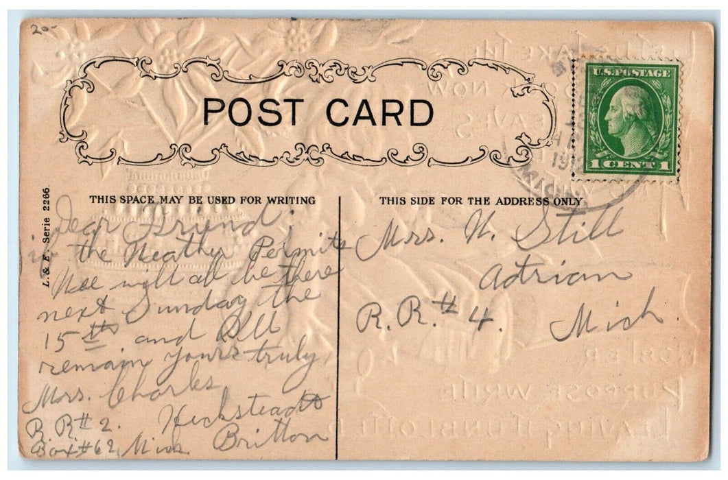 1912 Christmas Girl Writing Pointessia Flowers Embossed Posted Antique Postcard
