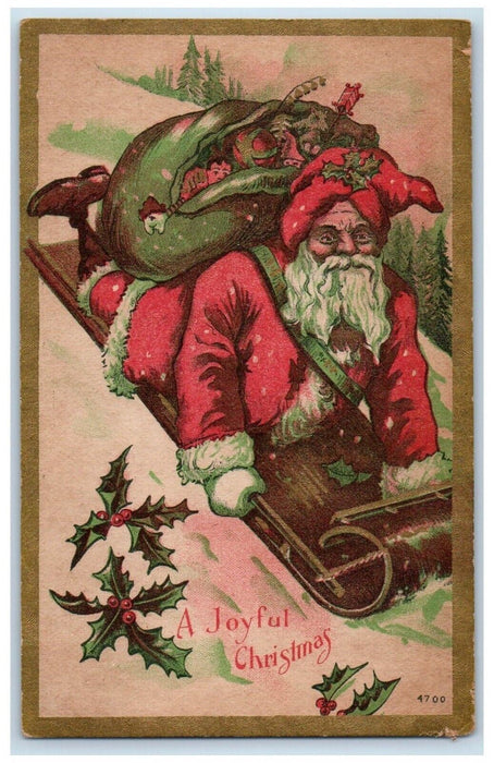 c1910's Christmas Santa Claus Sack Of Toys Sledding Holly Berries Postcard