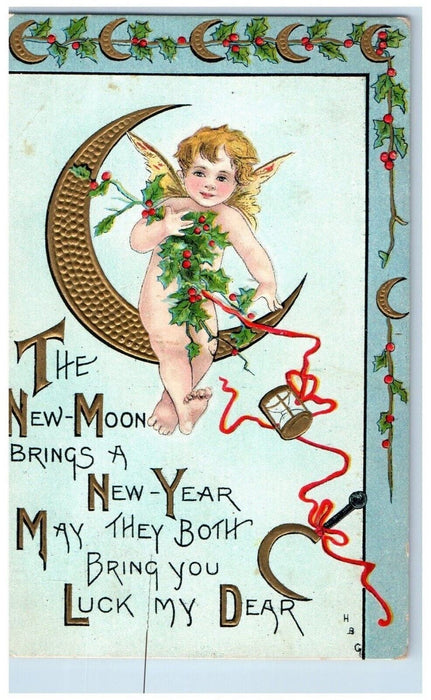 1908 New Year Angel Sitting In Crescent Moon Holly Embossed Antique Postcard