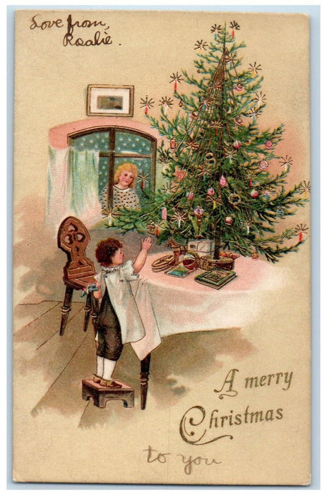 c1905 Christmas Tree Girl Decorating Candles Toys Embossed Antique Postcard