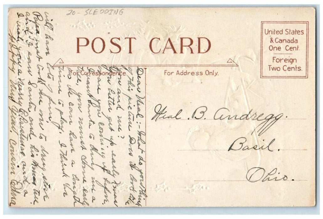 c1910's Christmas Greetings Boy Girl Sledding Winter Snow Embossed Postcard