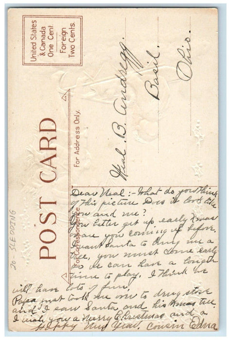 c1910's Christmas Greetings Boy Girl Sledding Winter Snow Embossed Postcard