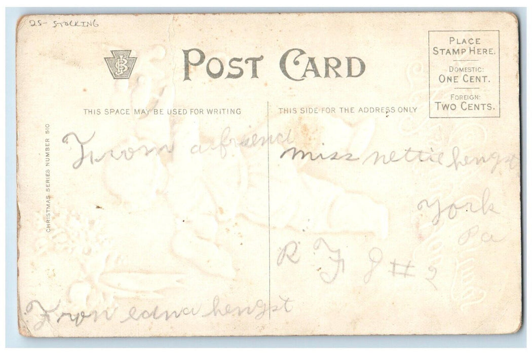 c1910's Christmas Boy Carrying Stockings Full Of Toys Embossed Antique Postcard