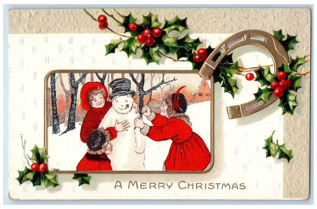 1910 Christmas Children Snowman Horseshoe Holly Berries Embossed Postcard