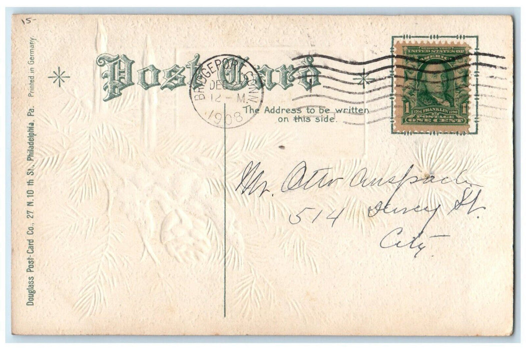 1908 Christmas Wishes Pine Cone Snow Candles Houses Embossed Antique Postcard