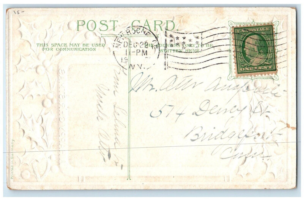 c1910's Christmas Pretty Angel White Lily Flowers Holly Berries Antique Postcard