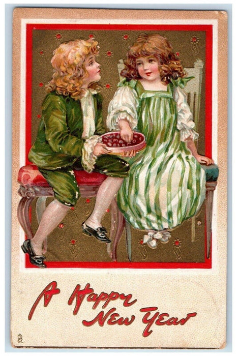 c1910's New Year Boy Girl Eating Chocolates Embossed Tuck's Antique Postcard