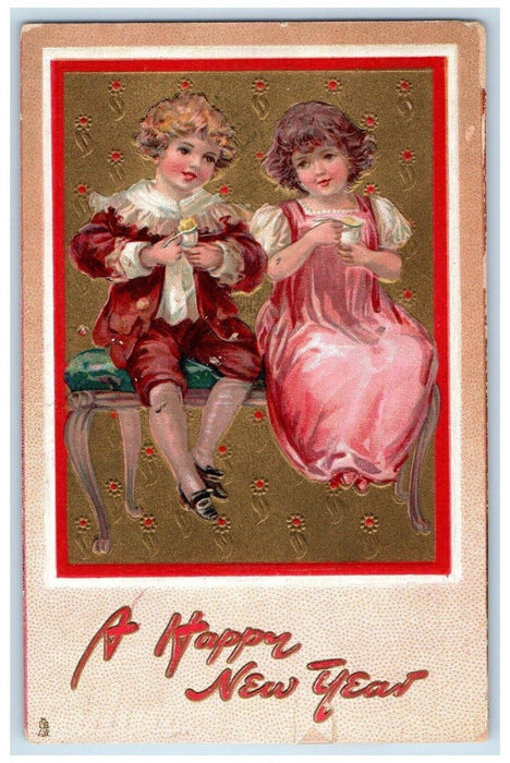 1909 New Year Girl And Boy Eating Pudding Embossed Tuck's Antique Postcard