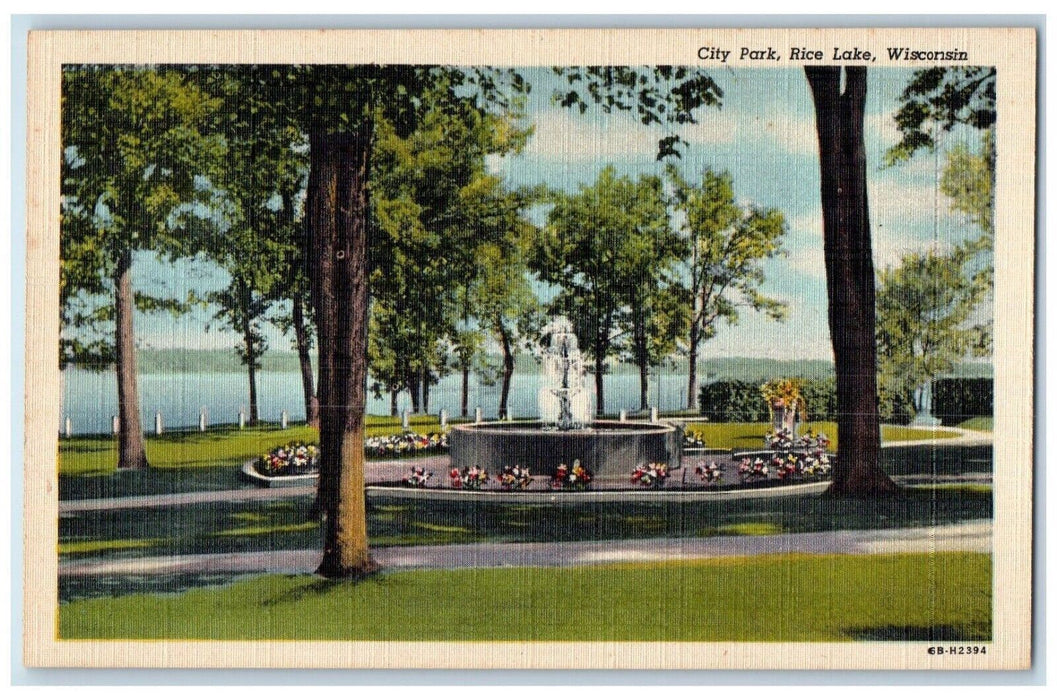 City Park Trees Flowers Water fountain Scene Rice Lake Wisconsin WI Postcard