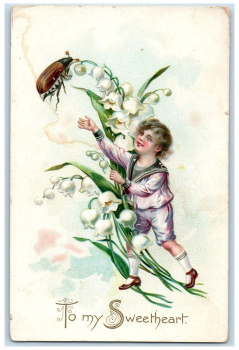 c1910's New Year Boy Lightning Bug Holly Berries Embossed Tuck's Posted Postcard
