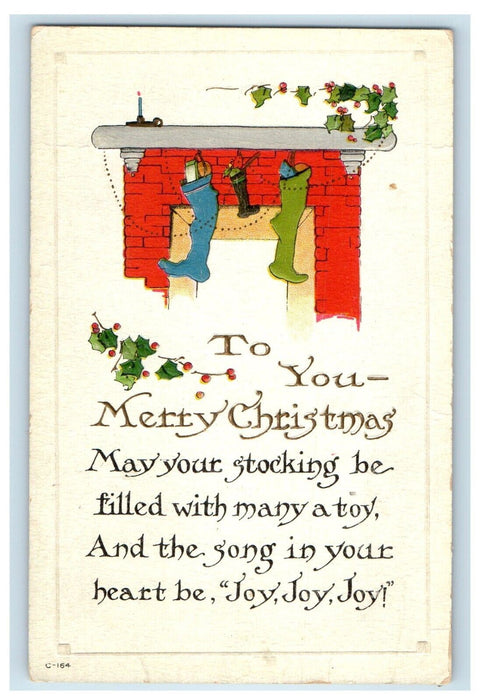 c1910's Merry Christmas Hanging Stockings Filled Toys Embossed Antique Postcard