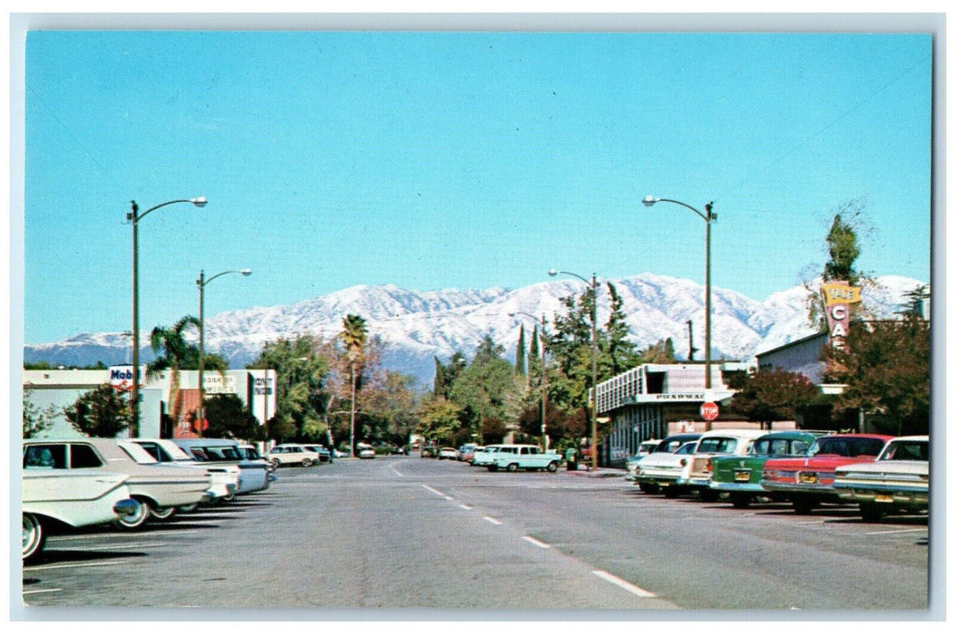 c1960's Cars Parking Scene Snow Capped Mountain Claremont California CA Postcard