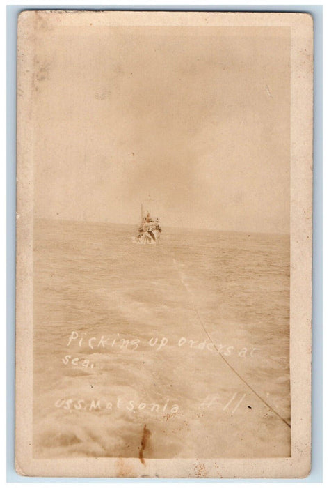 c1920's USS Matsonia Picking Up Orders At Sea Candid RPPC Photo Postcard