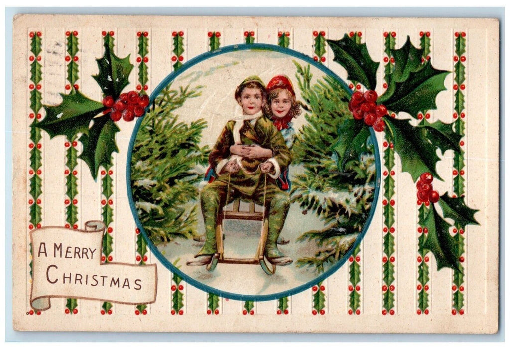 1912 Christmas Sweet Couple Sled Pine Trees Holly Berries Embossed Postcard