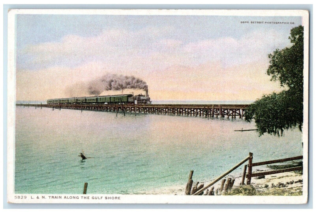 c1910 L&N Train Along Gulf Shore Locomotive Cargo Train Railroad River Postcard