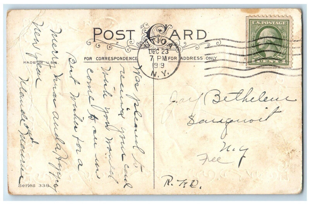 1919 Christmas Wishes Child Trumpet Cat Embossed Utica New York NY Postcard