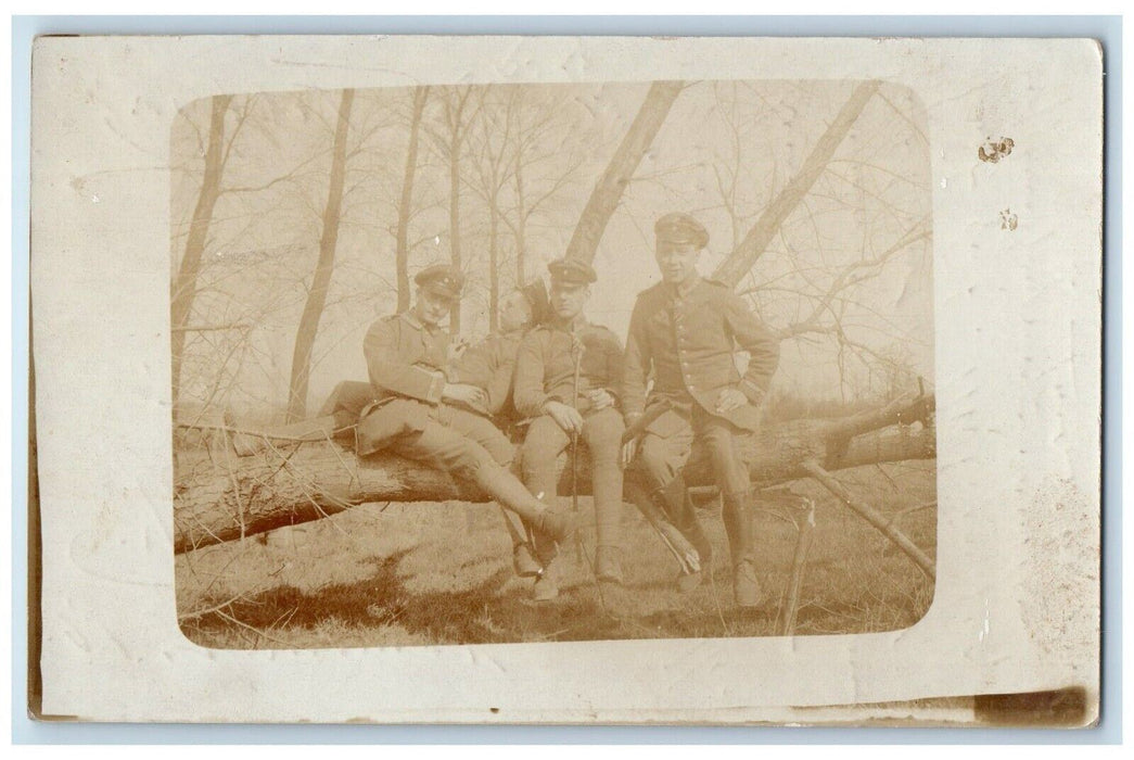 1916 Candid WWI Soldiers Resting On Tree Germany RPPC Photo Posted Postcard