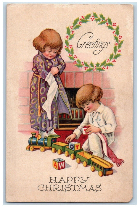 c1910's Christmas Greetings Children Playing Train Fireplace Berries Postcard