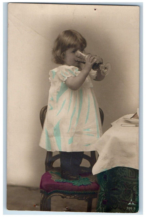 1908 Little Girl Drinking Saint Clair Ohio OH Posted Antique RPPC Photo Postcard