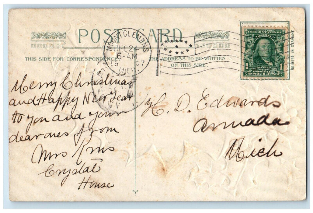 1907 Christmas Holly Berries Houses Winter Embossed Mount Clements MI Postcard