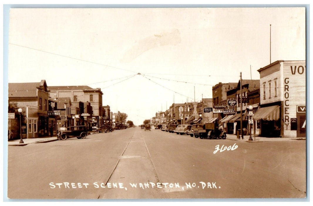 Street Scene Drug Store Bakery Cars Wahpeton North Dakota ND RPPC Photo Postcard