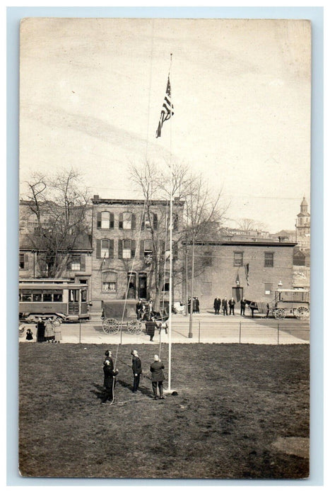 c1910 American Flag Raising Horse Wagon Streetcar Trolley RPPC Photo Postcard