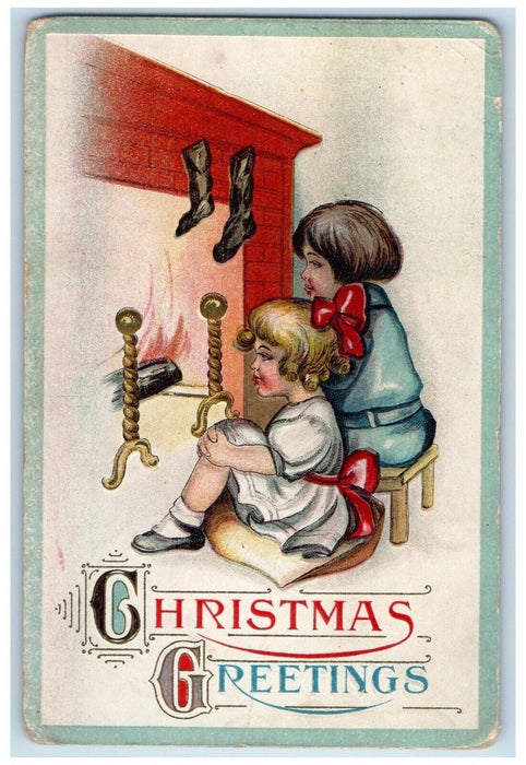 c1910's Christmas Greetings Fireplace Hanging Stockings Embossed Posted Postcard