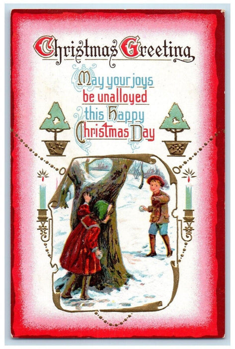 c1910's Christmas Greetings Girl Hiding Boy Snowball Fight Embossed Postcard