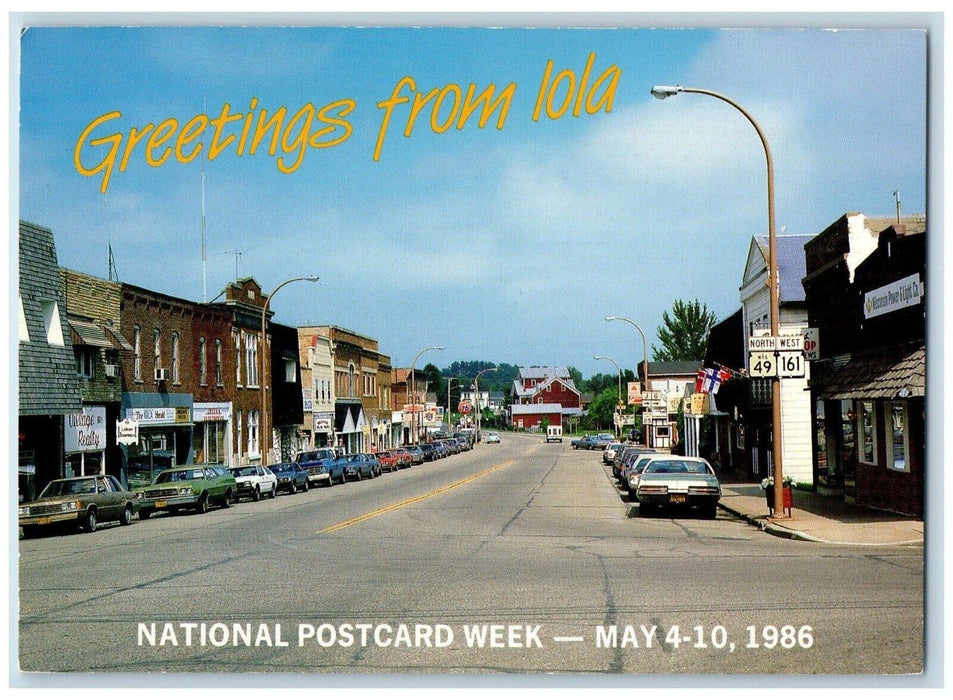 1986 Greetings From Lola Wisconsin Main Street Road Cars Vintage WI Postcard