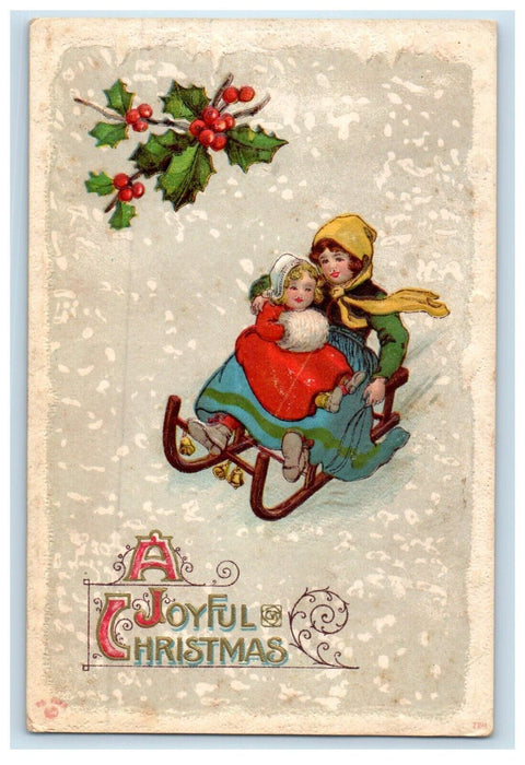 1911 Joyful Christmas Mother And Child Sled Holly Winter Snow Embossed Postcard