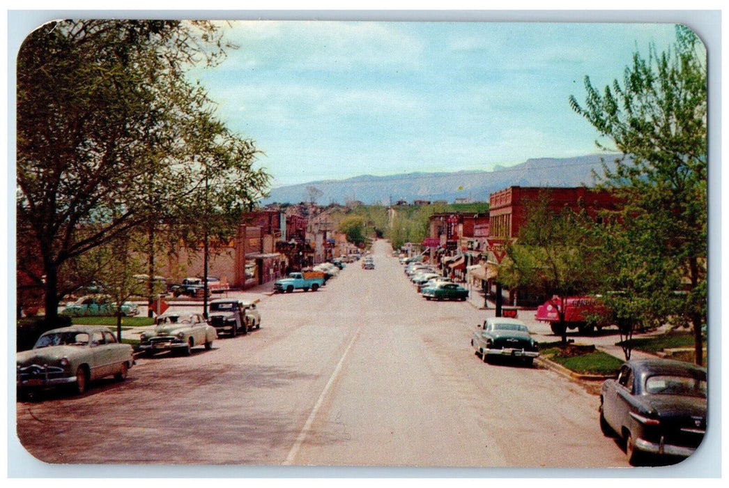 View Of Business District Street Car-lined Scene Rifle Colorado CO Postcard