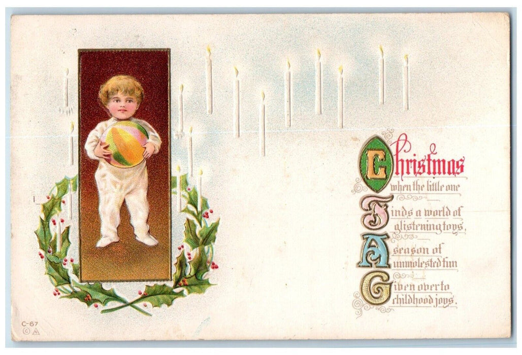 c1910s Christmas Little Boy Holding Ball Holly Berries Candles Embossed Postcard