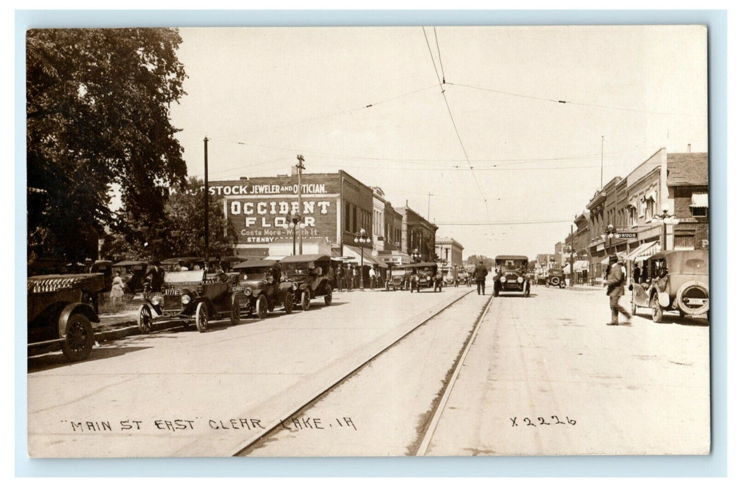c1920's Clear Lake Iowa IA Main St. East Classic Car License RPPC Photo Postcard
