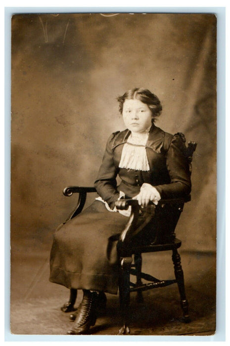 1912 Victorian Woman Sitting Wicker Chair Studio Portrait RPPC Photo Postcard