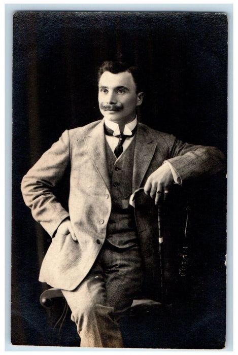 1910 Man Sat On Chair Mustache Studio Portrait Latvia Russia RPPC Photo Postcard