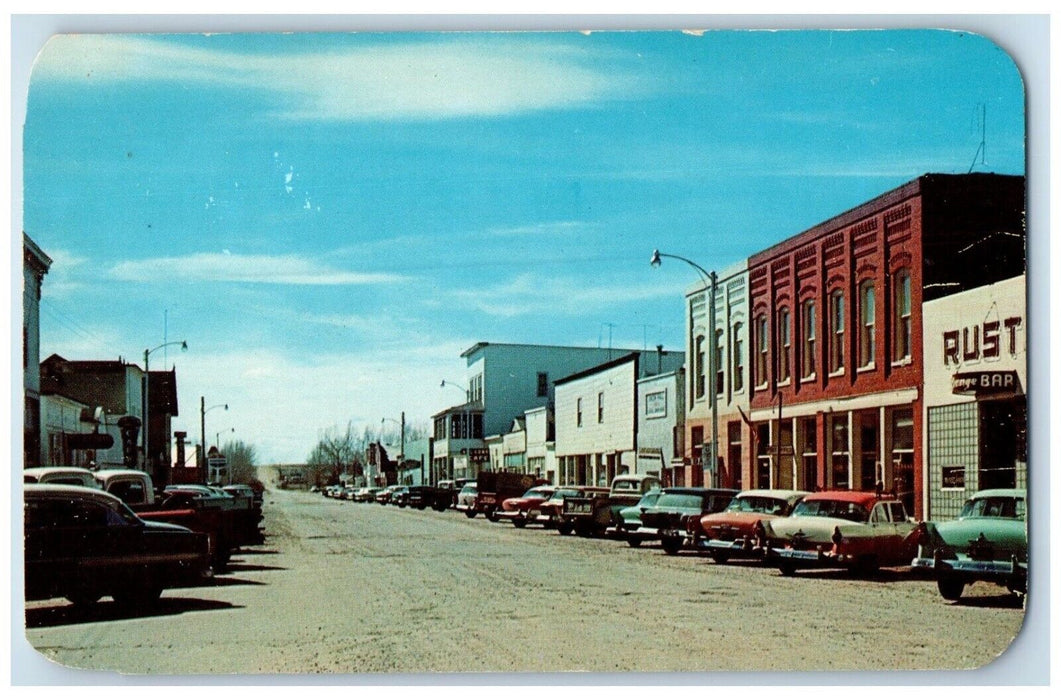 c1950's Bridge St. And Business District Looking West Cars Saratoga WY Postcard