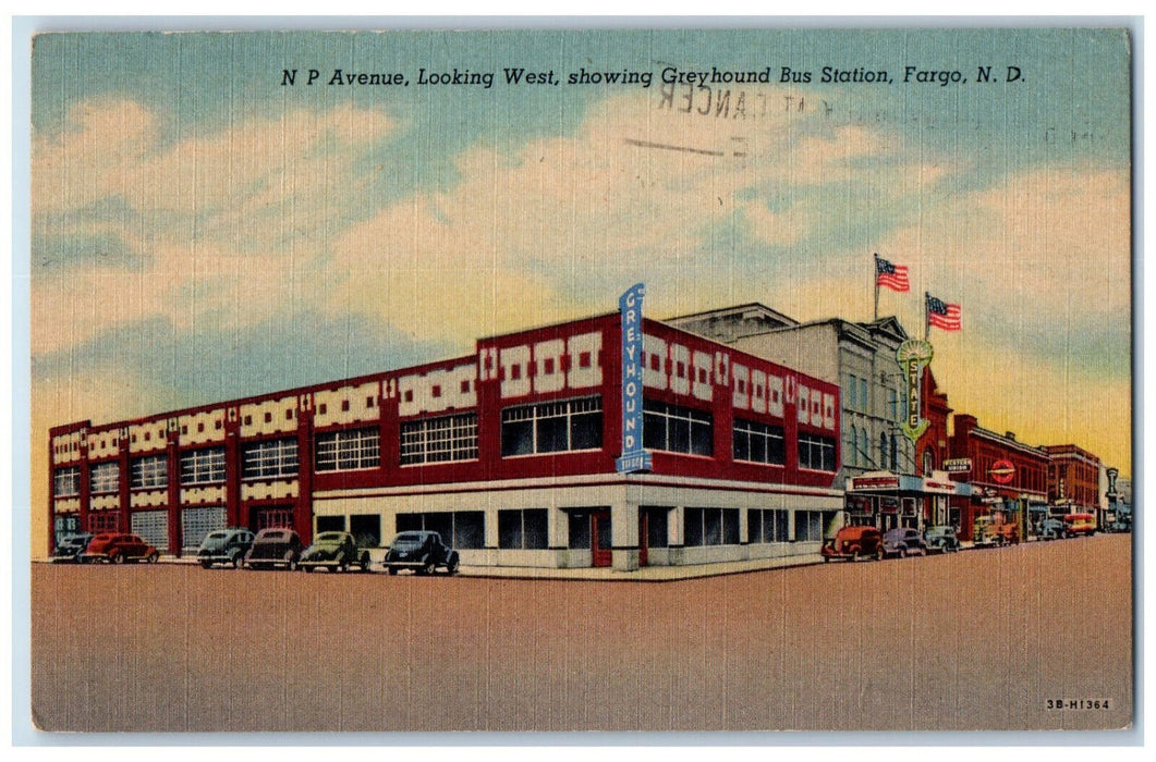 1957 NP Avenue Looking West Showing Greyhound Bus Station Fargo ND Postcard