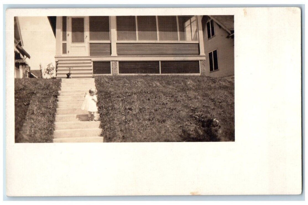 1917 Little Girl Stairs Tricycle Residence Dubuque Iowa IA RPPC Photo Postcard