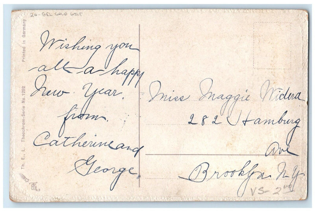 c1910's Christmas Angel Flute Holly Berries Gel Gold Gilt Embossed Postcard