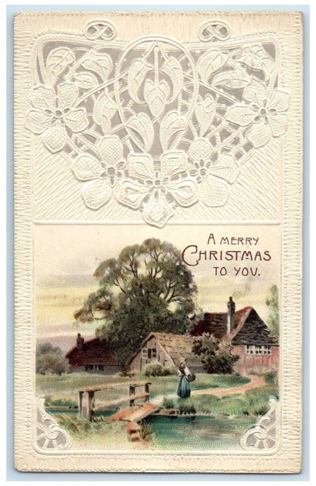 1914 Christmas House And Trees River Embossed Ludington MI Antique Postcard